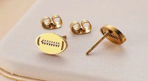 GOLD STUD FOOTBALL EARRINGS